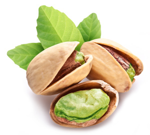 Pistachio nuts with leaves.